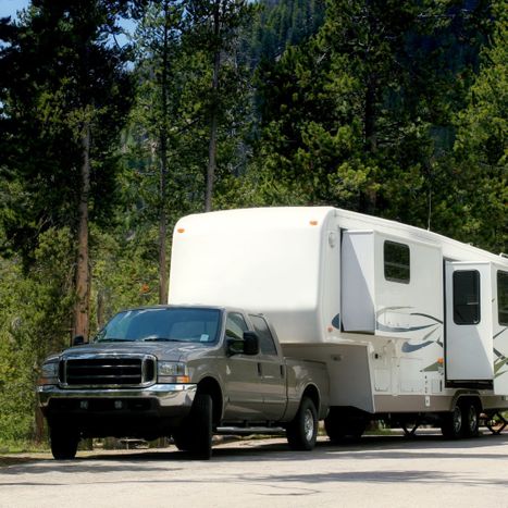 truck towing camper trailer