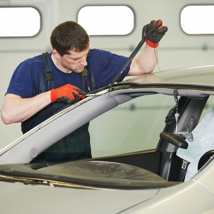 technician installing a windshield