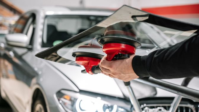 Technician Replacing Windshield 