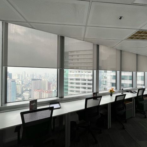A commercial office space with tinted windows.