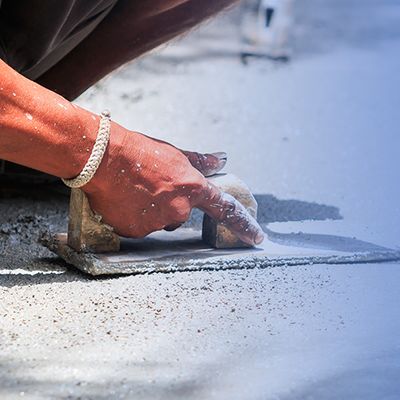 Man smoothing concrete