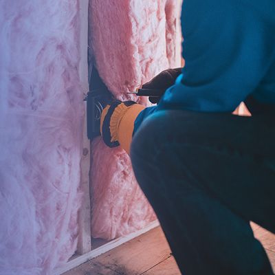 Man installing insulation