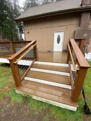 new deck in the rain 597239074_1352010506938313_9191043397159689558_n.jpg