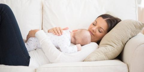 Woman with child laying down