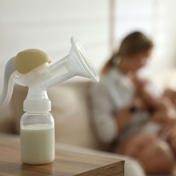 Breast pump flange and subtle financial elements, representing comfort and cost Breast pump flange and subtle financial elements, representing comfort and cost