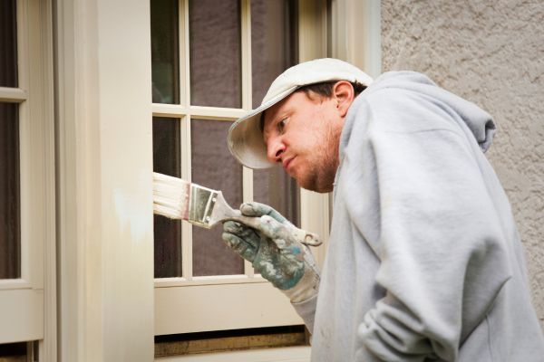 person painting trim