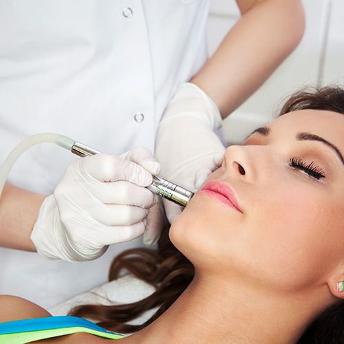 Image of a woman getting a laser treatment