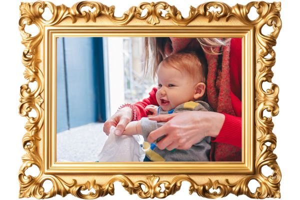 a woman wiping a babies hands