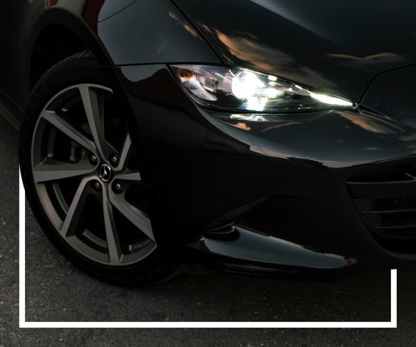 front end of a black mazda front end of a black mazda