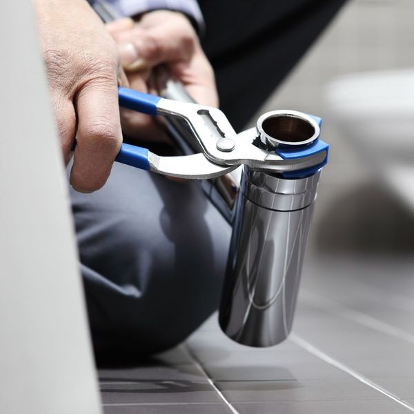 plumber connecting pipes