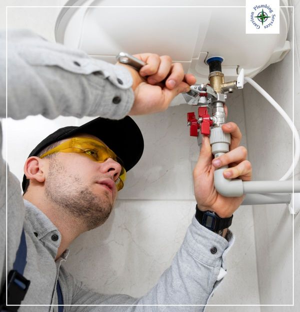 plumber working on sink