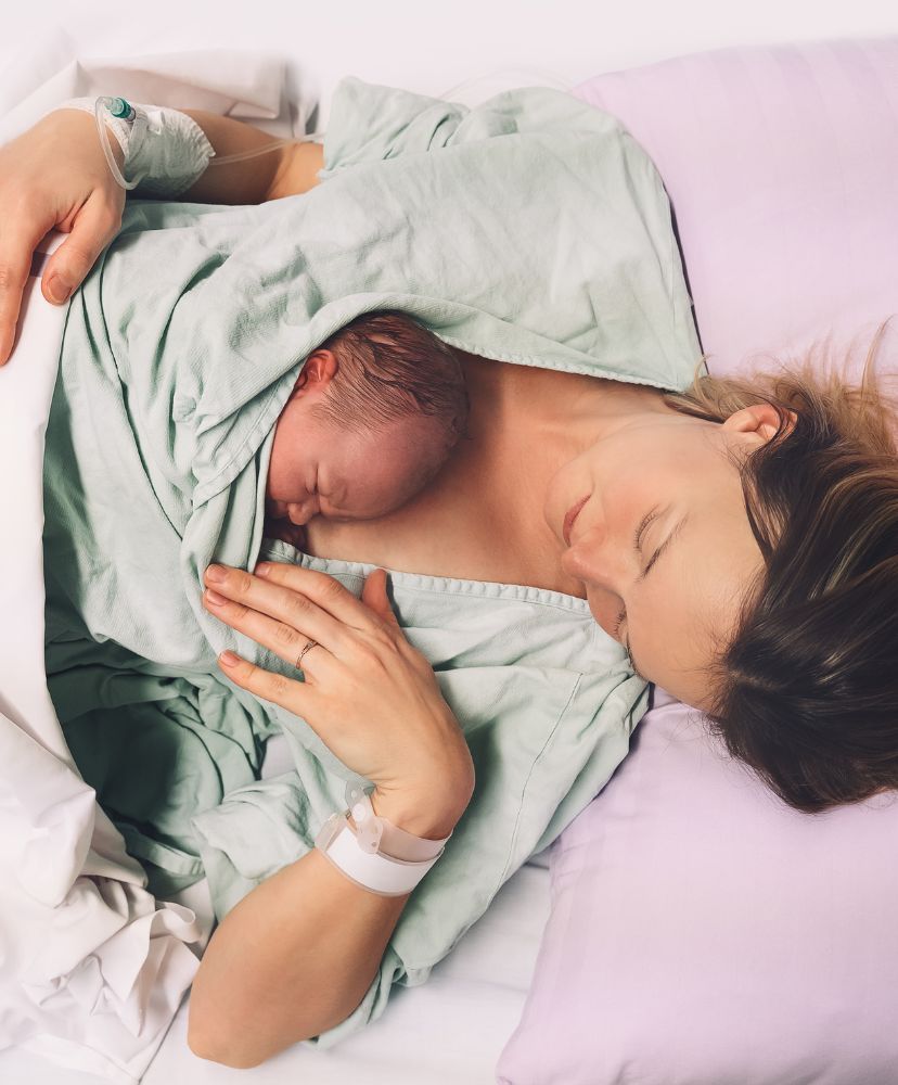 Mother with newborn baby on her chest