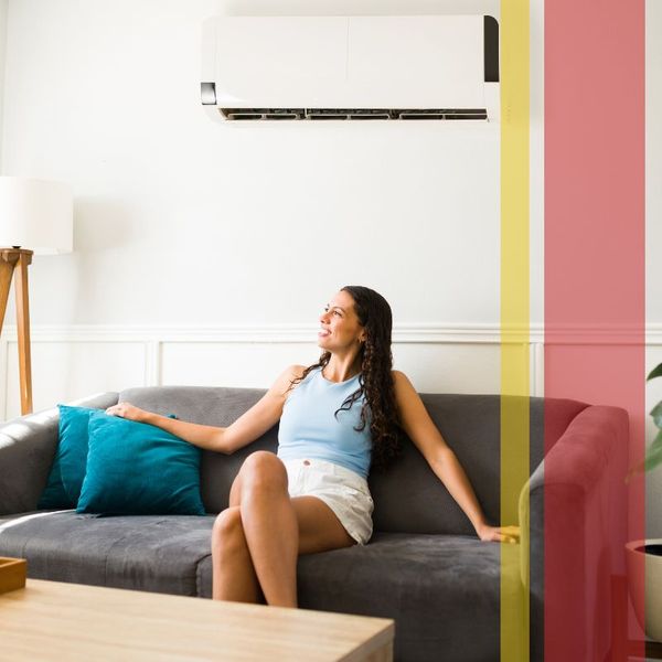 Woman enjoying fresh, cool air in home.