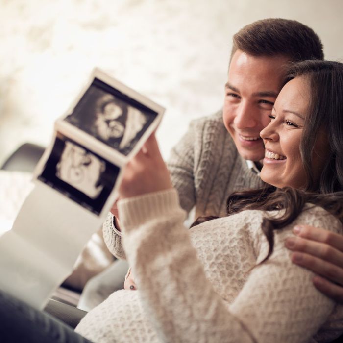 Couple looking at ultrasound photos