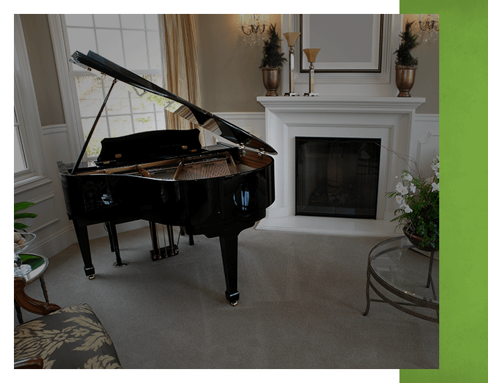 piano in a room with fireplace