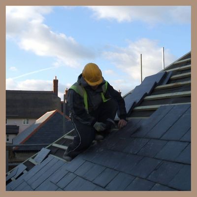 man fixing roof