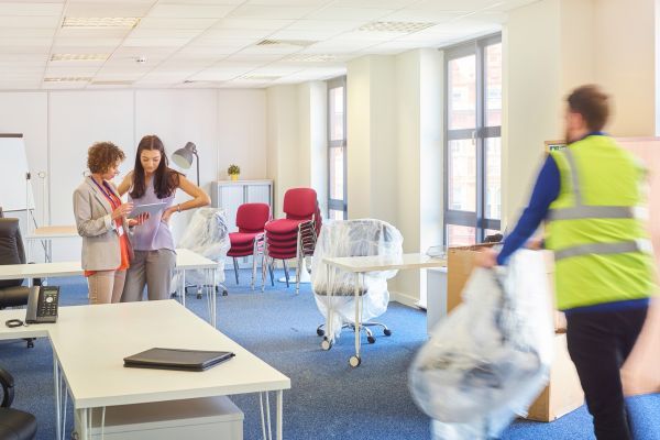Women talk during office move