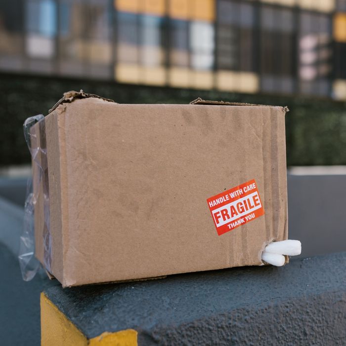 Damaged box with a fragile sticker