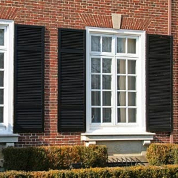 black exterior shutters on brick home