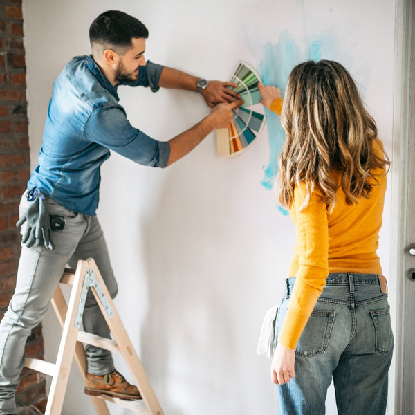 a couple painting their home