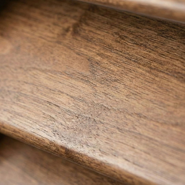 Close-up detail of the natural wood grain on a custom interior shutter