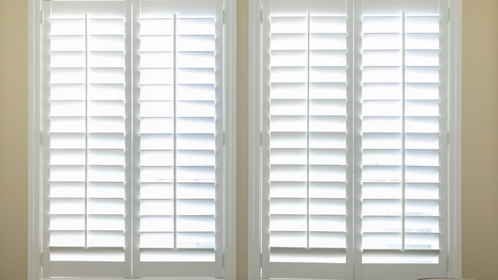 White shutters inside a home. 