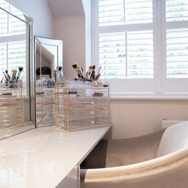 make up area with mirror and natural light from window Why Interior Shutters Are Worth the Investment 4.jpg