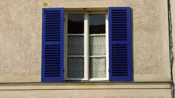 Blue exterior window shutters