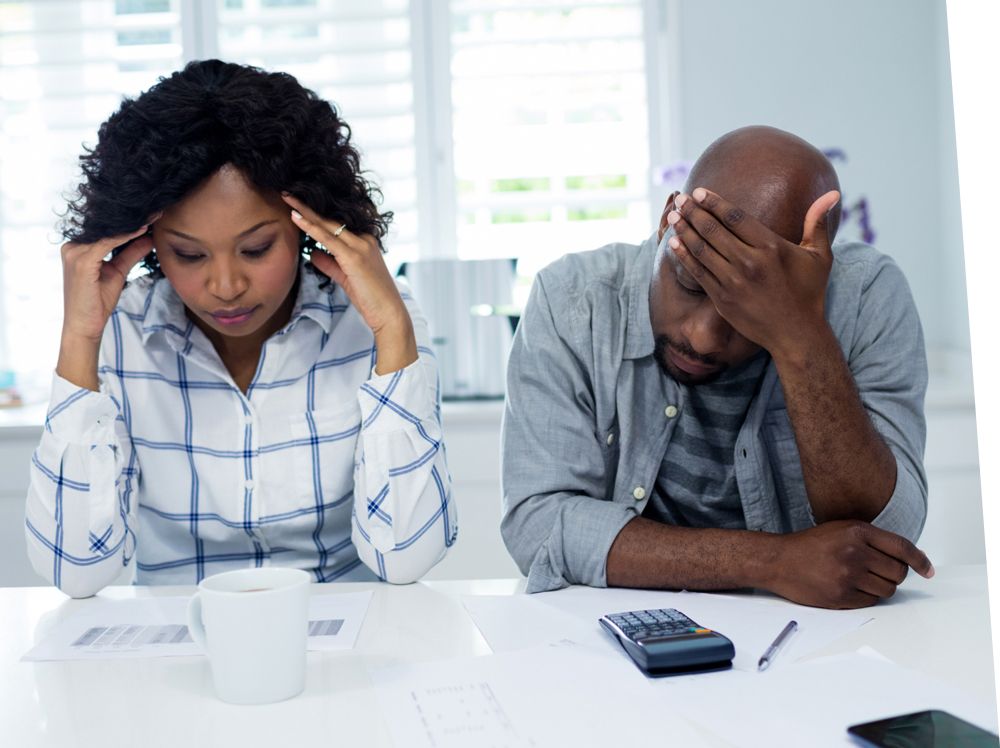 A couple looking stressed about bills