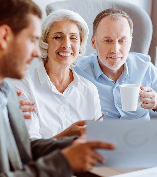 An older couple speaking with a tax professional