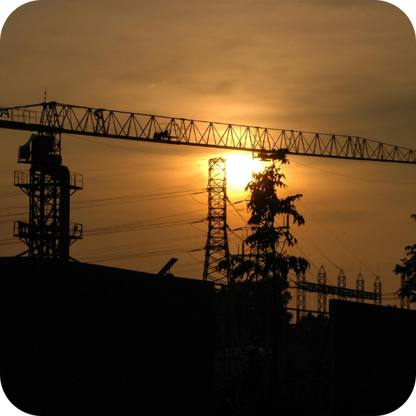 commercial building under construction at sunset