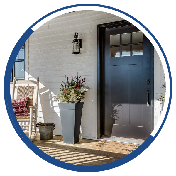 A nice sunlit porch with a new front door.