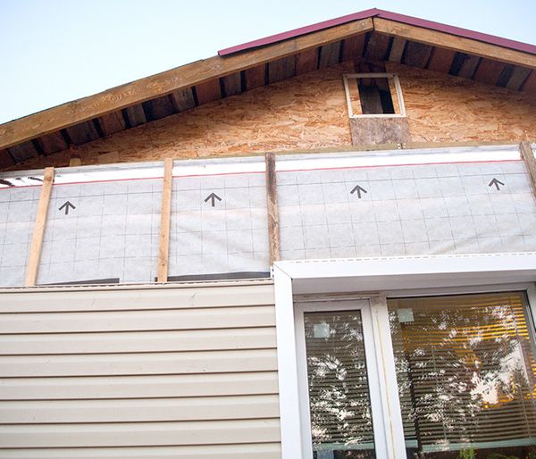 Image of siding being added to a house