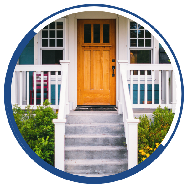 A bright wooden door on a charming front porch