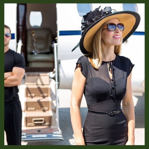 A high-profile individual prepares to board a private jet under the watchful eye of executive security.