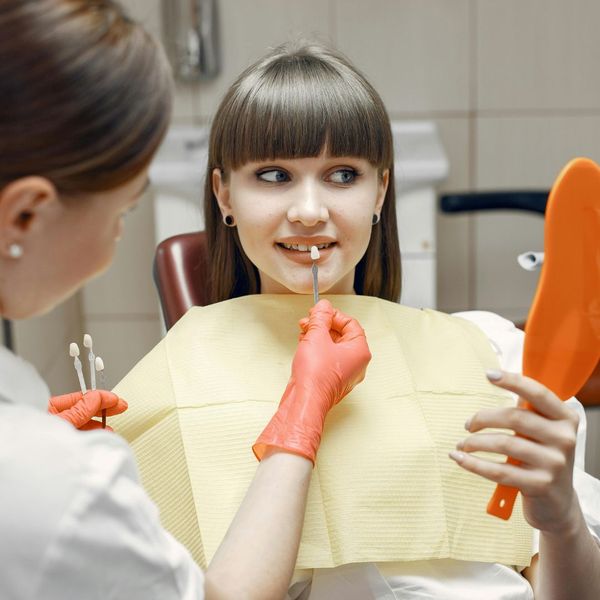 woman looking at a veneer