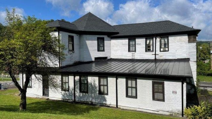 white house with black roof
