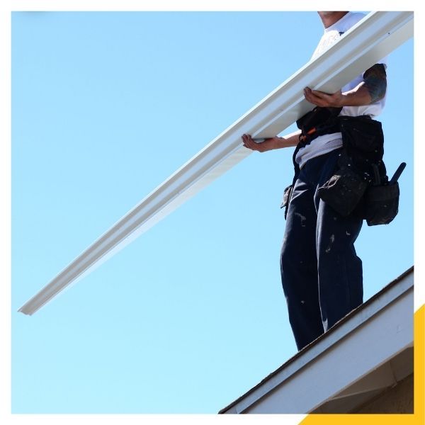 technician installing k-style gutters