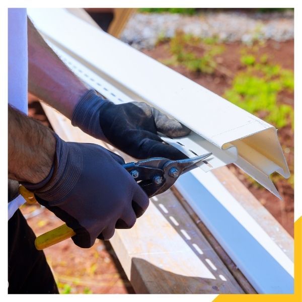 technician trimming custom gutters
