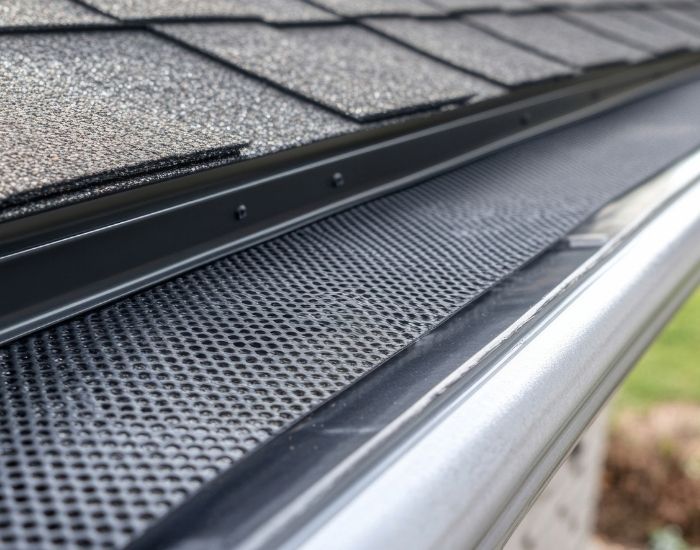 Gutter with a leaf guard Gutter with a leaf guard