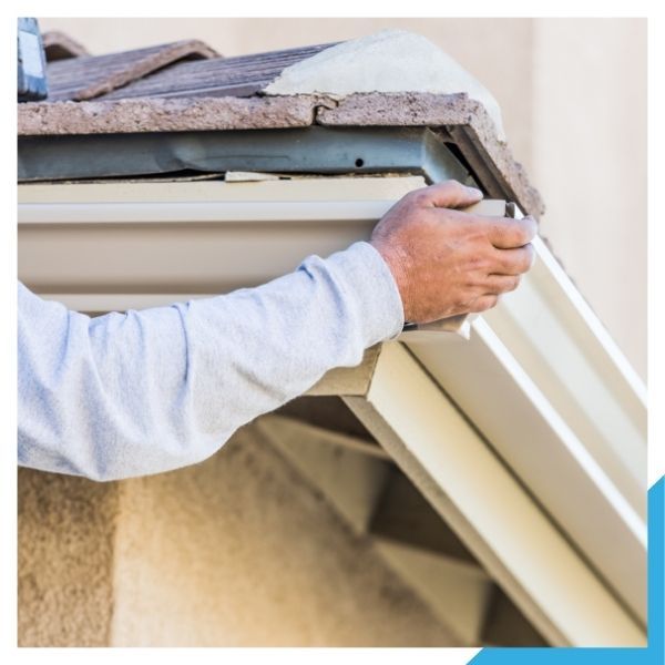 technician installing K-style gutters