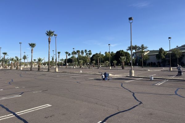 A parking lot with multiple cracks