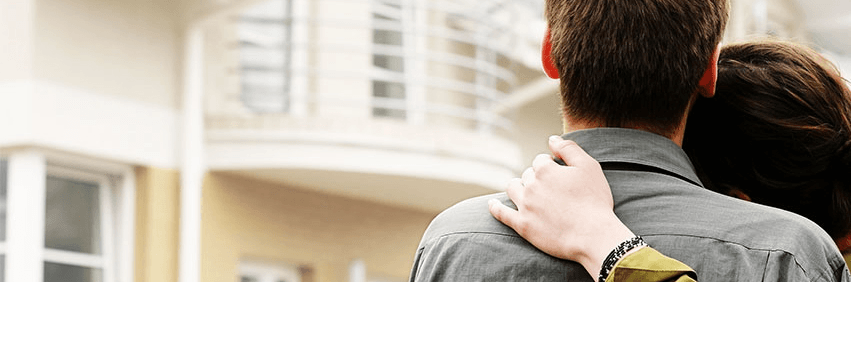 Image of a couple looking at a home