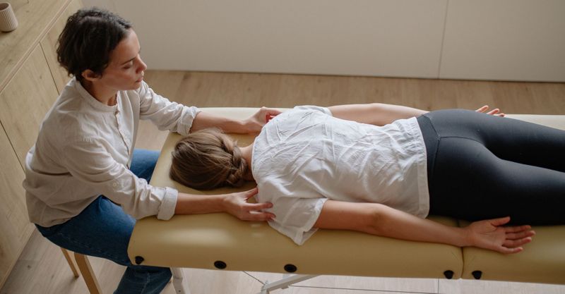 chiropractor with patient