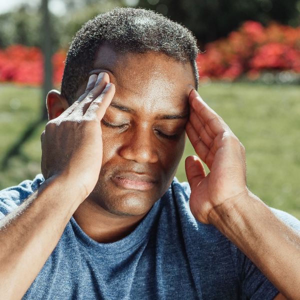 a man with a headache When to Seek Chiropractic Care for Neck Pain (2).jpg