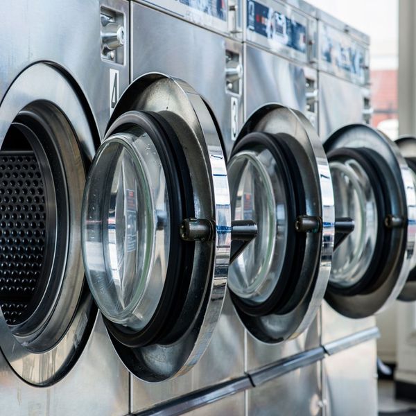 a row of laundry machines