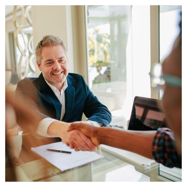 realtor shaking hands with client