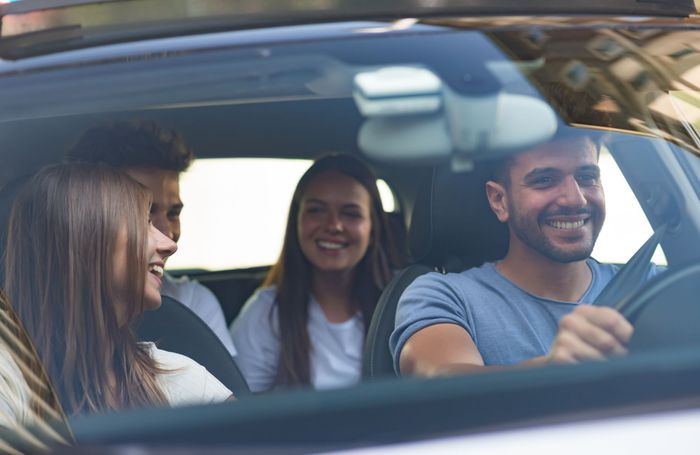 Friends driving in a car