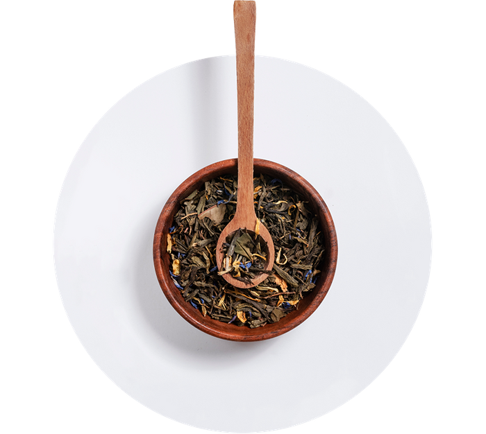 wooden bowl of loose leaf tea