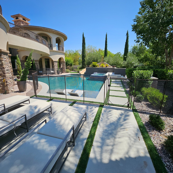 A custom fence around large pool